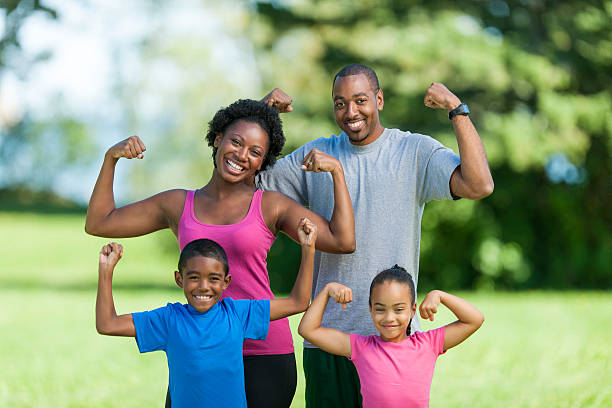healthy active african american family outside in the park